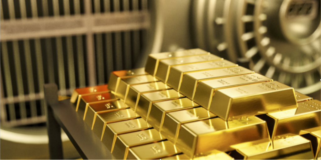 Storing Precious Metals Various bars of gold in front of a safe. 